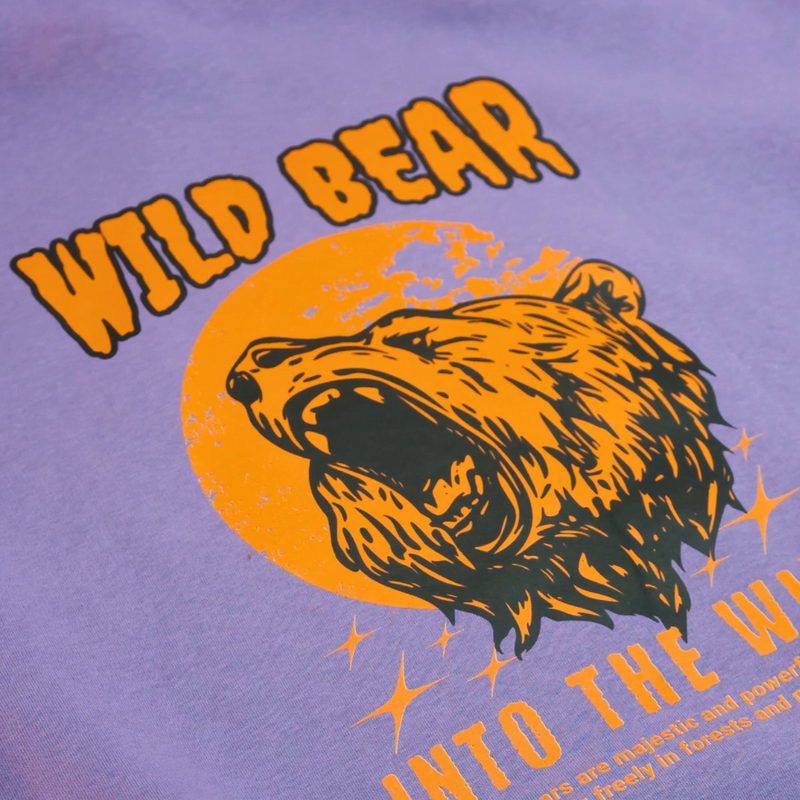 Load image into Gallery viewer, DTF Transfers Wild Bear graphic design on a purple shirt, featuring bold text and a roaring bear illustration.
